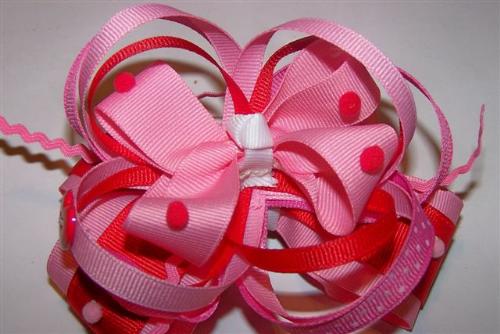 Valentine Bows - Funky Bows with many different types of ribbon, ric-rac, hearts and pom-poms.  All hand sewn and ends are treated to prevent fraying.