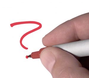 Question Mark - A picture of a hand writing a question mark on white paper in red marker.  A royalty-free image from StockXchange, www.sxc.hu