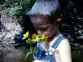 Child smelling flowers - scents do bring back memories for some people