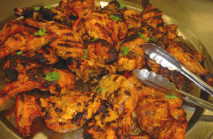 Tandoori Chicken - It is a typical North Indian Dish made of chicken. It is very spicy, tasty and my favorite!