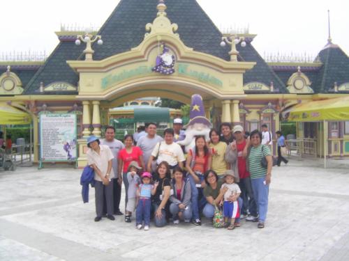 Family Fun at Enchanted Kingdom - Photo taken with Enchanted Kingdom's mascot at the park's entrance.