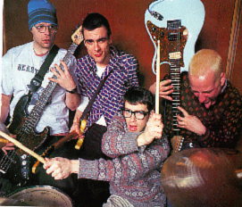 weezer oo weezer - a photo of weezer members playing in their studio,rivers cuomo not singing in that picture , he'playing a drum..haha