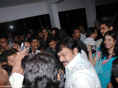 chiranjeevi - he is receiving responses from the crowd of people.