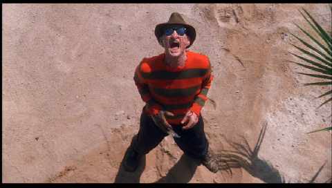 Freddy on the beach - Freddy triumphant after pushing a girl into the sand.