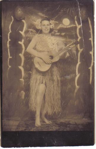 old fashioned hoola girl - a costume photo, black and white, woman dressed up as a hoola dancer.