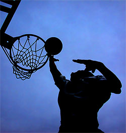 Me dunking - This is a picture of me dunking at the hieght of 5'7.5. I am practing in a court trying to inprove me skills, when the next thing your know i am hagging off the rim. A 10ft rim! I was so proud of my self. i acually can doin with no problem. i A secret to being able to dunk early is to work out your calves. They will give you major junpming power and your hamstrings. Just make your legs really strong!!!