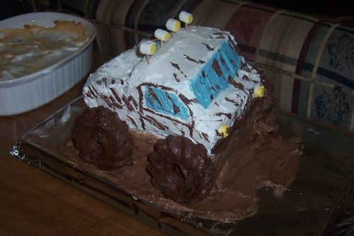 Monster truck birthday cake - This is a monster truck cake that  I made for my son's 18th birthday (he's in to big trucks right now). My daughter helped with the decorating and her boyfriend 'splashed the mud' on it.