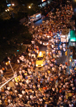 People! -  A crowd of people is slowly moving on a street!