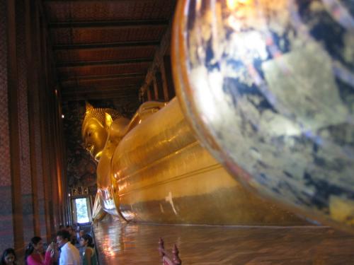Sleeping Buddha at Wat Po - This is the biggest sleeping Buddha at Wat Po, being made out of gold. It was built by the ancient Thai kings. At the surface of the Buddha's feet denotes the human lifecycle - life after death and beyond.