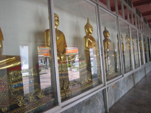 Bangkok - Wat Po - Buddhist statues made out of gold in Bangkok's Wat Po.