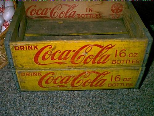 Coca cola crates - These are two wood crates from Coca Cola. They date back to the 1970. I am a big Coca Cola fan and collect everything that I can get my hands on. Most of the crates are open in the middle but some do have dividers in them which makes them very rare. Most of the crates are worth around $25 to $75 each.