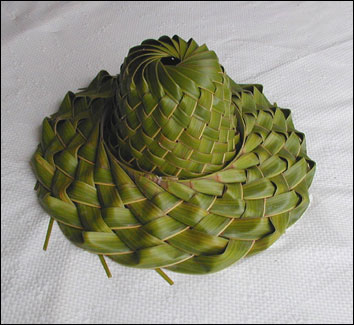 A palm frond hat - Hand woven palm frond hat expertly produced by Key West palm frond weavers. Hat will remain green for about a month before turning brown!!!!