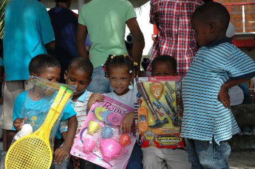 Kids - I'd give anything to see kids with that smile on their faces. As a Family Tradition.. at the beginning of each new year's we gather around toys to give as present to poor kids. This year... there were 80 kids... between the ages of 0 - 8 years... They had a great time.. and WE had a great time watching them this happy.