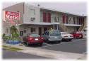 A  Motel - A type of hotel in which parking is provided at or near the room and the room door.