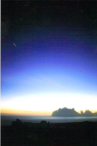Twilight at La Push, Washington - This photograph was taken while camped on the beach on Washington's Olmpic Coastline in 2004.  The coolest part about this photo is that I placed the camera on a tripod and left the shutter open for a whole 5 minutes.  It was nearly dark and you can see the movement of a star within those five minutes.