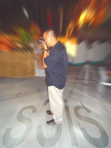 myself - photo of me while using a Canon S3is camera - photoshopped