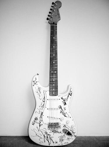 BRYAN ADAM's GUITAR(legend) - this is the guitar of the singing legend bryan adams which was auctioned for the noble cause of helping TSUNAMI struck people. it was auctioned for 10000 dollars isn't it great