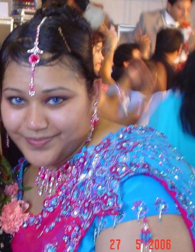 Me in a sari! - This was taken last year in May on my sisters wedding. It was one of the first times that I wore an expensive indian dress which cost me over £200!!!!It was the latest style at that time too, called a butterfly sari, where the back is a different colour to the rest of the sari, and you dont have to plete it over the shoulder, as the materail has already been cut in a butterfly design, where the centre that goes on your shoulder is heavily embroidered like a big brooch!   Also as I am a big lady, I had mine tailor made, where I customised the colour and the design of my sari, therefore I am confident in knowing it is a one-off piece especially for me and it fitted me perfectly! I had it done in hot pink and turquoise!!  However, I went on a diet in August, where I ended up losing some weight! So when I went to wear that sari again in my friends brother wedding in October, guess what? It didnt fit! The blouse was too loose on me! Over the Christmas period though, I seem to have successfully gained the pounds back on so it probably fits me again now :(    Oh well, I guess I'll have to try and go back on that diet!!