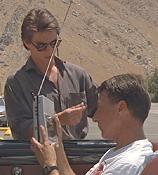 Scene from Rainman - Raymond talks to Charlie while Charlie watches his portable TV