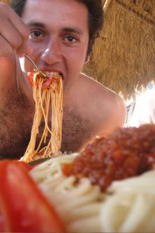 mouthful of spaghetti - Man eating spaghetti
