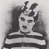 3 squares a day! - An old black and white photo of Charlie Chaplin wearing an old fashioned prison uniform