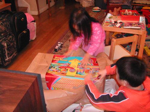 kids opening gift - kids opening a big present 