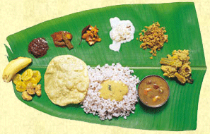 south india delicacies - the photo showing various south india dishes on banana leaf