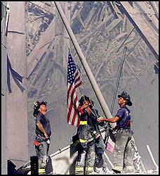 Firefighters putting up US flag on ground zero - Firefighters putting up US flag on ground zero.