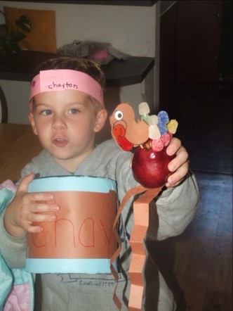 my son showing off his Thanksgiving crafts - My son showing off all of his crafts from school
