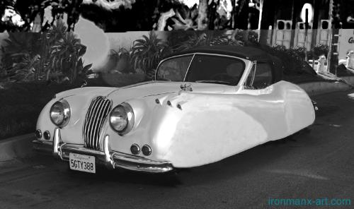 2026 Jaguar XK 140 - This is some manipulated photo art, of a digital photo I took of this Jaguar. It and its owner live in Bell Mont Shore, California.
