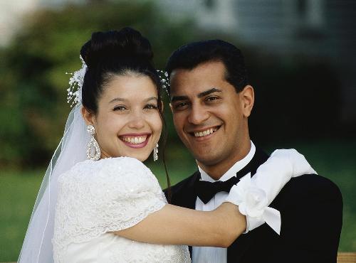 Newly Wedded - Newly wedded couple standing together falling in love