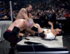 Batista against Kane and Big Show - This is a photo taken from the match of Batista and the partners Kane and Big Show. As you can see, Batista is injured from a recent match with the strongest man, Mark Henry. People say that when Mark Henry slammed a steel cage door against Batista's tricepts