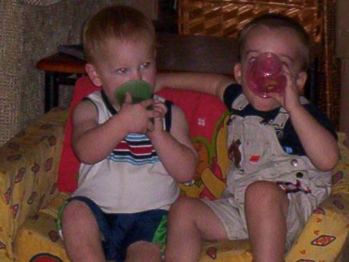 my son with his sippy cup, with a friend and his.  - my son and his friend with thier sippy cups.