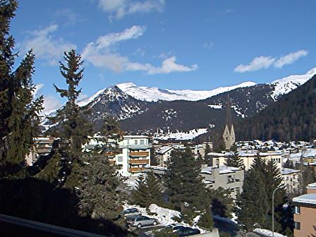 Davos - Shows some condos in Davos, Switzerland and pine trees and very blue skies.