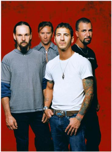 Godsmack just keeps on banging your head -  The Boston-based alternative metal group Godsmack originally comprised vocalist Sully Erna (a devout Wiccan), guitarist Tony Rambola, bassist Robbie Merrill, and drummer Tommy Stewart. After debuting in 1997 with All Wound Up, Godsmack signed with Universal, which in 1998 reissued the LP as a self-titled effort with a handful of new tracks; at that point Stewart -- who'd left the group in mid-1997 and was replaced by drummer Joe d'Arco -- returned to the lineup on a permanent basis. The band's audience built slowly but surely, and Godsmack was certified gold in 1999, the same year the group was invited to join the Ozzfest tour; by the next year, it had sold over three million copies, thanks to hit singles like 'Whatever' and 'Keep Away.' In 2000, the group again played Ozzfest, and released their second proper album, Awake, that fall. In January 2001, Awake earned the band a Grammy nomination for Best Rock Instrumental Performance for the song 'Vampires,' and by March, it had sold two million copies. Hot on the heels of their continuing success, their single 'I Stand Alone' propelled the hype of the movie The Scorpion King in March 2002. As the single maintained Godsmack's strong presence at modern rock radio into the summer, founding member Tommy Stewart left the band in June. The David Bottrill-produced (Peter Gabriel, Tool, Mudvayne) album Faceless appeared in April 2003. It also marked the debut of ex-Amen drummer Shannon Larkin. The all-acoustic Other Side arrived in spring 2004. In 2006, Erna stepped behind the board to helm IV, a collection of new material that reached number one while both retaining the group's trademark heft and expanding their sonic palette.