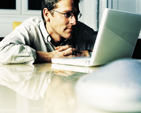Working on Laptop - Person working on his new Laptop