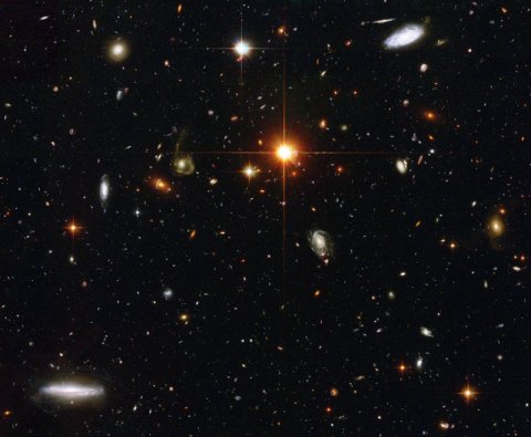 Deep Sky Galaxy Field in Fornax....Hubble Telescop - This photo is the result of a 40 hour exposure stacking several images taken in September 2003 by the Hubble Space Telescope. The size of the spot in the sky where this is located is about the size of the full moon. The diffraction spikes show foreground stars in our galaxy, all other tiny specks of light or color in this image that is not black....is a galaxy. This is a typical view of the 'empty' dark spots in our night sky. Magnificent.  Tom