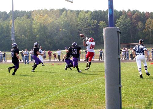 A touch town catch at a local High School Football - When you take Sports Action Pictures timing is very important.  You have to anticipate the action and hope it where you think it will.  In this shot I was able to catch the player and ball in the air.  Tocatch such photos ona consistant basis you need to take many pictures.  I will take about 150 to 200 pictures a game.  In some respects I consider those pictures as my pratice.  When a new sports season starts i figure that it will take me aobut 1/2 the first game just getting my timming back for the sport.  I have had people who have better cameras that I do and wonder why they don't get as good of picture as i do.  The difference is practice, you might get luckly but practice is most important and understanding the sport.