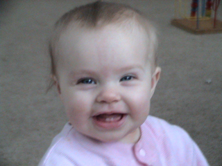 my smiling baby girl - This is my baby girl who is 9 1/2 months old and showing off her new teeth that came in on Christmas.