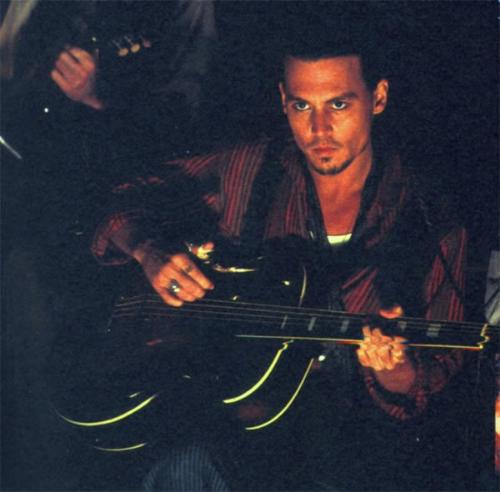 Gorgeous Johnny Depp - Johnny playing guitar. This is from the movie 'Chocolat.'