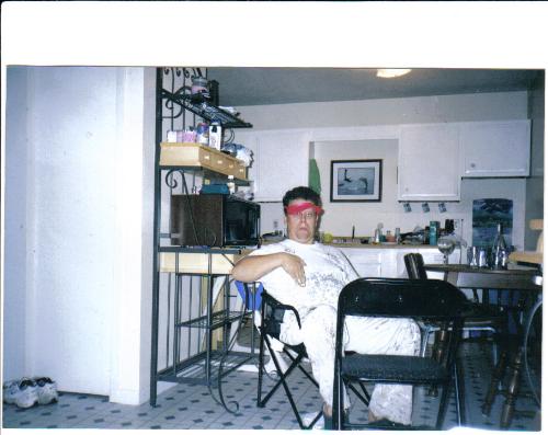 my hubby - Here is a really funny picture of my husband he just got off owrk and was drunk. I love it it is my black mail picture