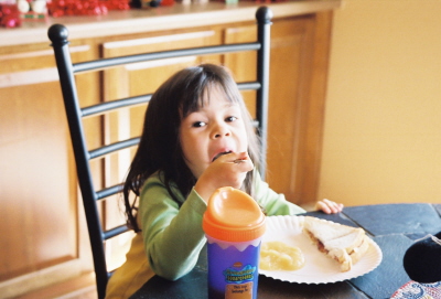 girl eating - My daughter eating and being a goof.