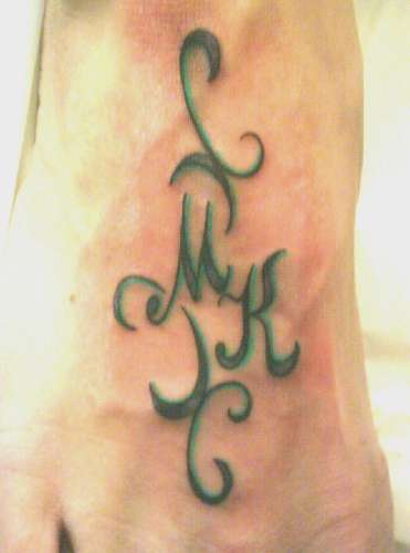 My Foot Tattoo - I got this tat done for my daughters. Their initials are M & K.