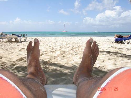 Punta Cana Beach, Dominican Republic - Our nephew sent us this picture that was taken when he and his girlfriend went to Punta Cana Beach. I thought it was a great shot..of the beach, not his feet!