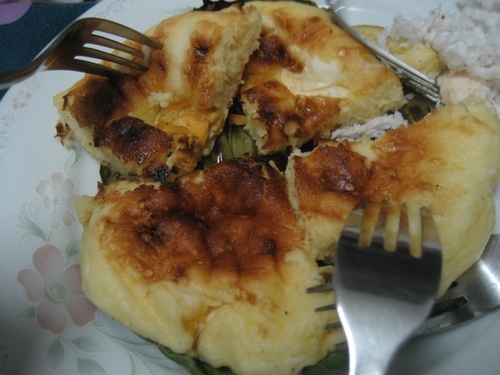 bibingka - Bibingka is a famous delicacy from the Philippines made out of rice flour, sugar, eggs and topped with salted egg. A really tasty treat that'll make you crave for more.