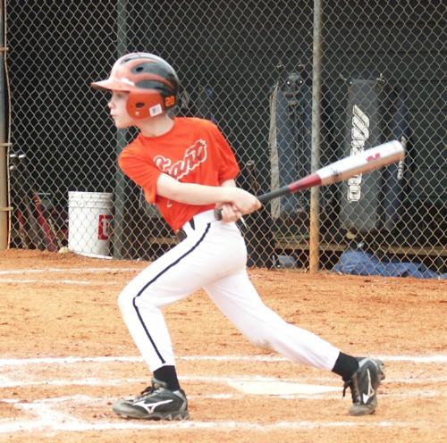 One of my ball players - Middle son hitting it hard.