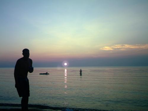 Craig at sunset - My daughters boyfriend Craig, at a beach in MI.
