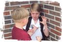 Bully - A kid bullying another kid from school.