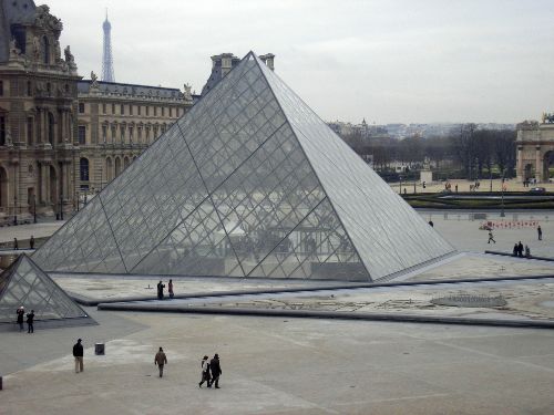 Louvre Pyramid, Paris France - As seen on Da Vinci Code movie. It's a large metal and glass pyramid which serves as the main entrance to the catacombs (famous burial place in France)