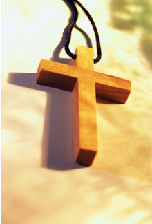 Wooden cross necklace - Photo of a wooden cross necklace